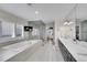 Bright and open primary bathroom with a large tub, walk-in shower, and double vanity at 2616 E Cherry Creek South Dr, Denver, CO 80209
