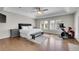 Spacious bedroom with a large bed, hardwood floors, and large windows for natural light at 2616 E Cherry Creek South Dr, Denver, CO 80209