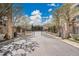 Elegant gated community entrance with stone pillars and manicured landscaping offers security and prestige at 2616 E Cherry Creek South Dr, Denver, CO 80209