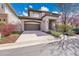 Charming two-story home with landscaped yard, a covered entryway, and an attached two-car garage at 2616 E Cherry Creek South Dr, Denver, CO 80209