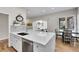 Kitchen featuring stainless appliances, a dining area, and access to the living room at 2616 E Cherry Creek South Dr, Denver, CO 80209