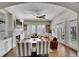 Spacious living room with a fireplace, large windows, and hardwood floors at 2616 E Cherry Creek South Dr, Denver, CO 80209