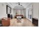 Stylish living room features hardwood floors, a tray ceiling, and a cozy seating arrangement at 2616 E Cherry Creek South Dr, Denver, CO 80209