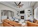 Living room boasts a fireplace, built-in shelving, and an open layout at 2616 E Cherry Creek South Dr, Denver, CO 80209