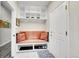 Mudroom featuring bench seating with overhead storage, a shoe rack and direct access to outside at 2616 E Cherry Creek South Dr, Denver, CO 80209
