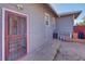 A partially-fenced backyard features an exterior door at 5723 Zephyr St, Arvada, CO 80002