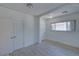 Bright bedroom features fresh white paint and new flooring at 5723 Zephyr St, Arvada, CO 80002