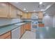 Corner of kitchen featuring neutral cabinets, green counters, and recessed lighting at 5723 Zephyr St, Arvada, CO 80002