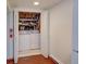 Convenient laundry room features a side-by-side washer and dryer and additional storage space at 5723 Zephyr St, Arvada, CO 80002