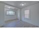 Cozy living room with natural light, neutral paint, and smooth transition to the next room at 5723 Zephyr St, Arvada, CO 80002