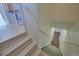 Marble staircase leading to a lower level with contrasting flooring at 5723 Zephyr St, Arvada, CO 80002