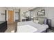 Bright bedroom featuring neutral colors, closet with mirrored doors, and a closet with built-in shelves at 1301 Speer Blvd # 403, Denver, CO 80204
