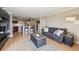 Bright living room featuring an open floor plan connecting to the kitchen, perfect for entertaining and modern living at 1301 Speer Blvd # 403, Denver, CO 80204