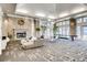 Bright lounge area featuring a stone fireplace, comfortable seating, and large windows at 1301 Speer Blvd # 403, Denver, CO 80204