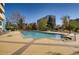Large outdoor pool with sun deck and building in the background on a clear day at 1301 Speer Blvd # 403, Denver, CO 80204