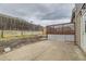 Backyard patio with a wooden fence at 6610 Monaco Way, Brighton, CO 80602