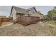 Backyard view of wooden deck at 6610 Monaco Way, Brighton, CO 80602