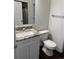 Bathroom featuring granite counters, white vanity and shower at 6610 Monaco Way, Brighton, CO 80602