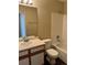 Bathroom featuring a tub-shower combo, white tile and single-sink vanity at 6610 Monaco Way, Brighton, CO 80602