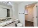 Bathroom featuring granite counters, a modern sink, and white cabinets at 6610 Monaco Way, Brighton, CO 80602