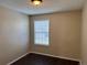 Bedroom featuring wood-look floors, neutral walls and window with blinds at 6610 Monaco Way, Brighton, CO 80602