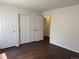 Bright bedroom with hardwood floors and closet, offering comfort and ample storage at 6610 Monaco Way, Brighton, CO 80602