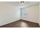 Cozy bedroom has wood floors, and a bright, sunny window at 6610 Monaco Way, Brighton, CO 80602