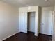 Bedroom showcasing closet and door at 6610 Monaco Way, Brighton, CO 80602