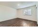 Empty bedroom features new wood floors, fresh paint and natural light at 6610 Monaco Way, Brighton, CO 80602