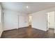 Bedroom featuring new floors, large closet and leads to a full bathroom at 6610 Monaco Way, Brighton, CO 80602