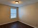 Bedroom featuring wood-look floors, neutral walls and window with blinds at 6610 Monaco Way, Brighton, CO 80602