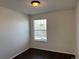 Neutral bedroom with hardwood floors, bright with a large window at 6610 Monaco Way, Brighton, CO 80602