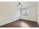 Dining area with wood floors, white walls, and a decorative light fixture at 6610 Monaco Way, Brighton, CO 80602