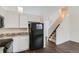 Kitchen features modern appliances, granite countertops and leads to carpeted stairs at 6610 Monaco Way, Brighton, CO 80602