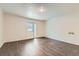 Bright living room featuring wood-look floors and neutral paint tones at 6610 Monaco Way, Brighton, CO 80602