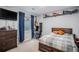 Bedroom with a blue accent wall, a desk, and a plaid comforter on the bed at 6039 S Ukraine Cir, Aurora, CO 80015