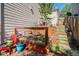 Beautifully landscaped garden area with raised beds and a charming stone pathway at 6039 S Ukraine Cir, Aurora, CO 80015