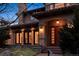 Inviting two-story home featuring a private entrance, warm lighting, and a meticulously kept landscape at 2975 E Wesley Ave, Denver, CO 80210