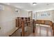 Upstairs landing with custom wooden desk and railing at 2975 E Wesley Ave, Denver, CO 80210