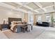 Spacious main bedroom suite boasts coffered ceiling, sitting area, and ample natural light at 2975 E Wesley Ave, Denver, CO 80210