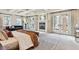 Bright main bedroom with a fireplace, coffered ceiling, french doors and a sitting area at 2975 E Wesley Ave, Denver, CO 80210