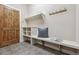 Mud room with built-in bench and storage by a wooden door at 2975 E Wesley Ave, Denver, CO 80210