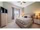 Comfortable guest bedroom with a queen-size bed and ample closet space at 672 W 128Th Pl, Westminster, CO 80234