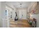 Bright and spacious entryway with wood-look flooring and built-in bench at 672 W 128Th Pl, Westminster, CO 80234