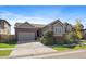 Attractive ranch home with a two-car garage, landscaping, and a welcoming front porch at 672 W 128Th Pl, Westminster, CO 80234