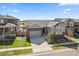 Inviting gray home featuring manicured landscaping and a convenient two-car garage, ideal for modern living at 672 W 128Th Pl, Westminster, CO 80234