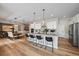 Modern kitchen with island and stainless steel appliances at 672 W 128Th Pl, Westminster, CO 80234