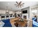 Open living space with a fireplace and kitchen views at 672 W 128Th Pl, Westminster, CO 80234