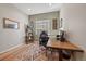 Home office with built-in shelving and a large desk at 672 W 128Th Pl, Westminster, CO 80234