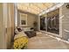 Covered patio with comfortable seating and a sliding glass door at 672 W 128Th Pl, Westminster, CO 80234